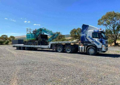Mega tilt tow truck loaded with a 14 tonne excavator - heavy towing from Sellicks to Seaford